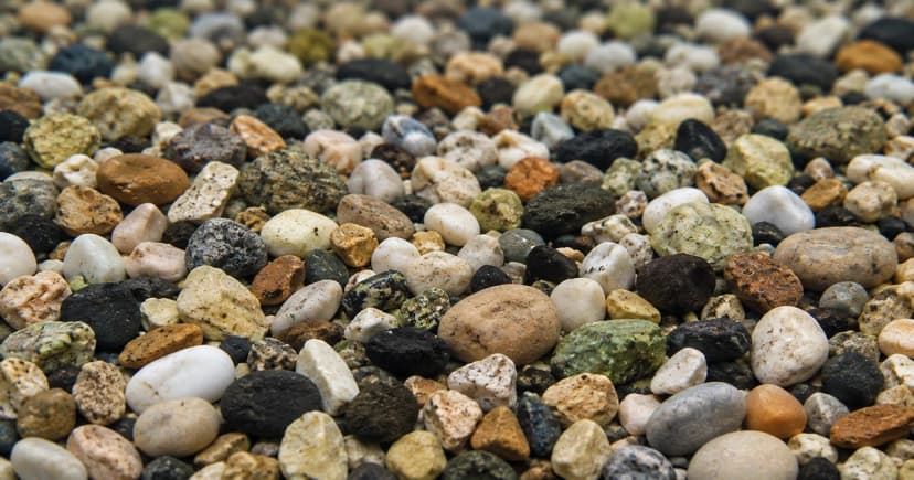 Close view of a reconstructed bed of mixed pale, gray and dark aquarium gravel.