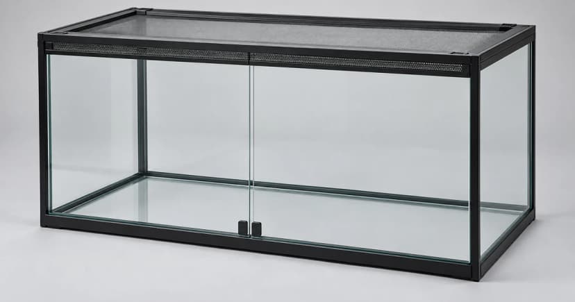 Edited generic empty front-glass reptile enclosure on a neutral surface
