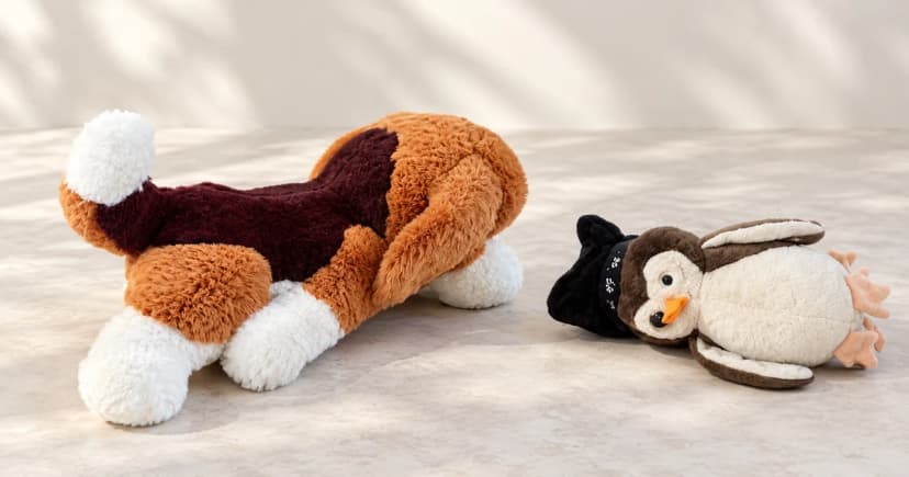 Photo-based edited equipment illustration of two separate plush toys, including a penguin-shaped toy