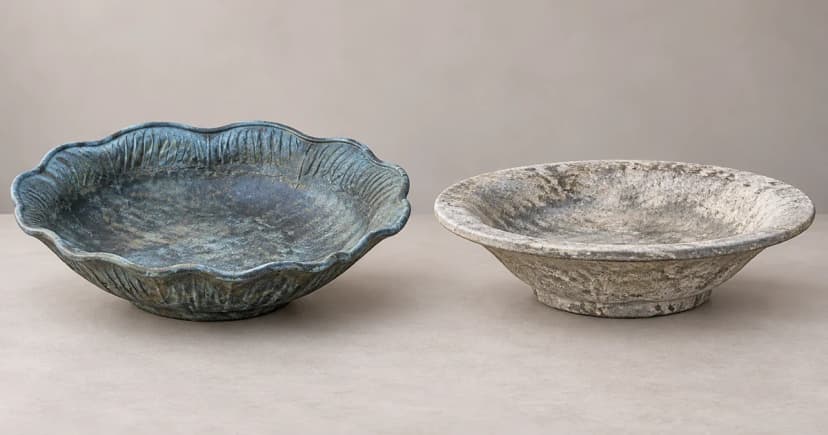 Two separate shallow bird-bath basins on a tabletop in an edited illustration.