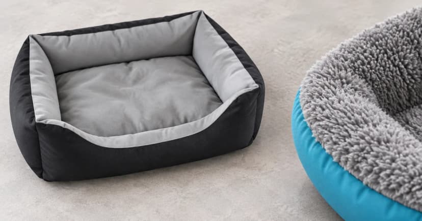 An empty black-and-gray bolster bed beside a separate close view of a pale-gray plush rim with teal edging.