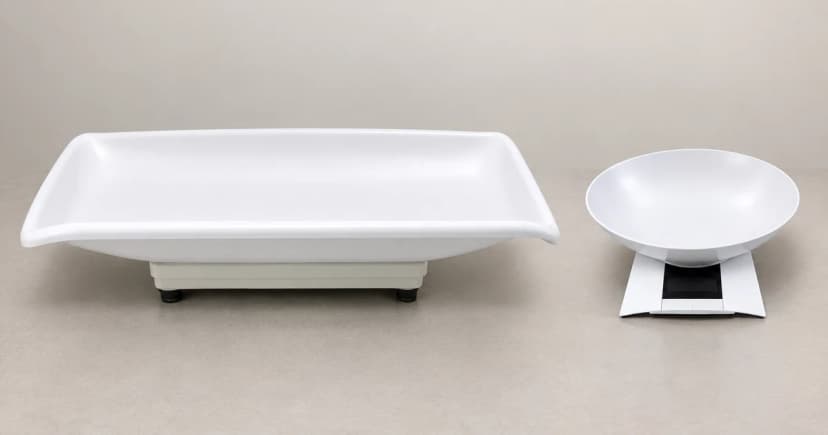 Edited illustration of two separate weighing devices, one with a broad tray and one with a round bowl.
