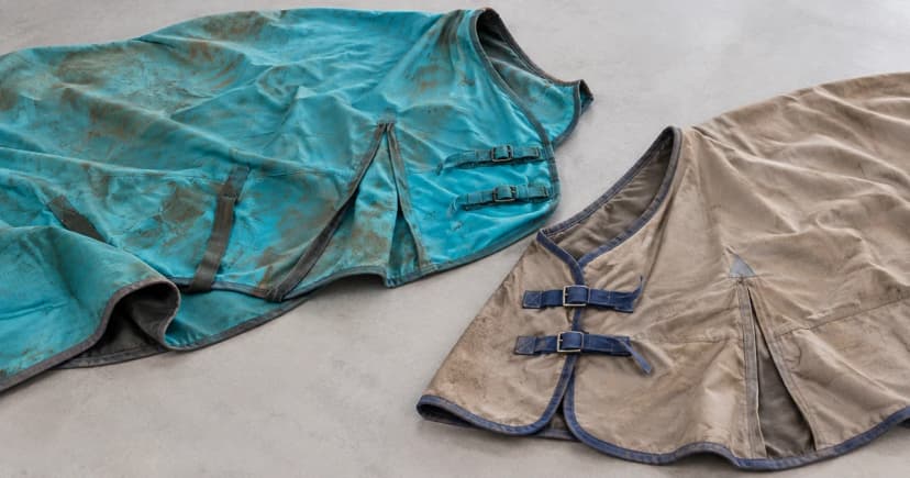 Edited illustration of separate turquoise and taupegray horse blankets partly spread on a tabletop